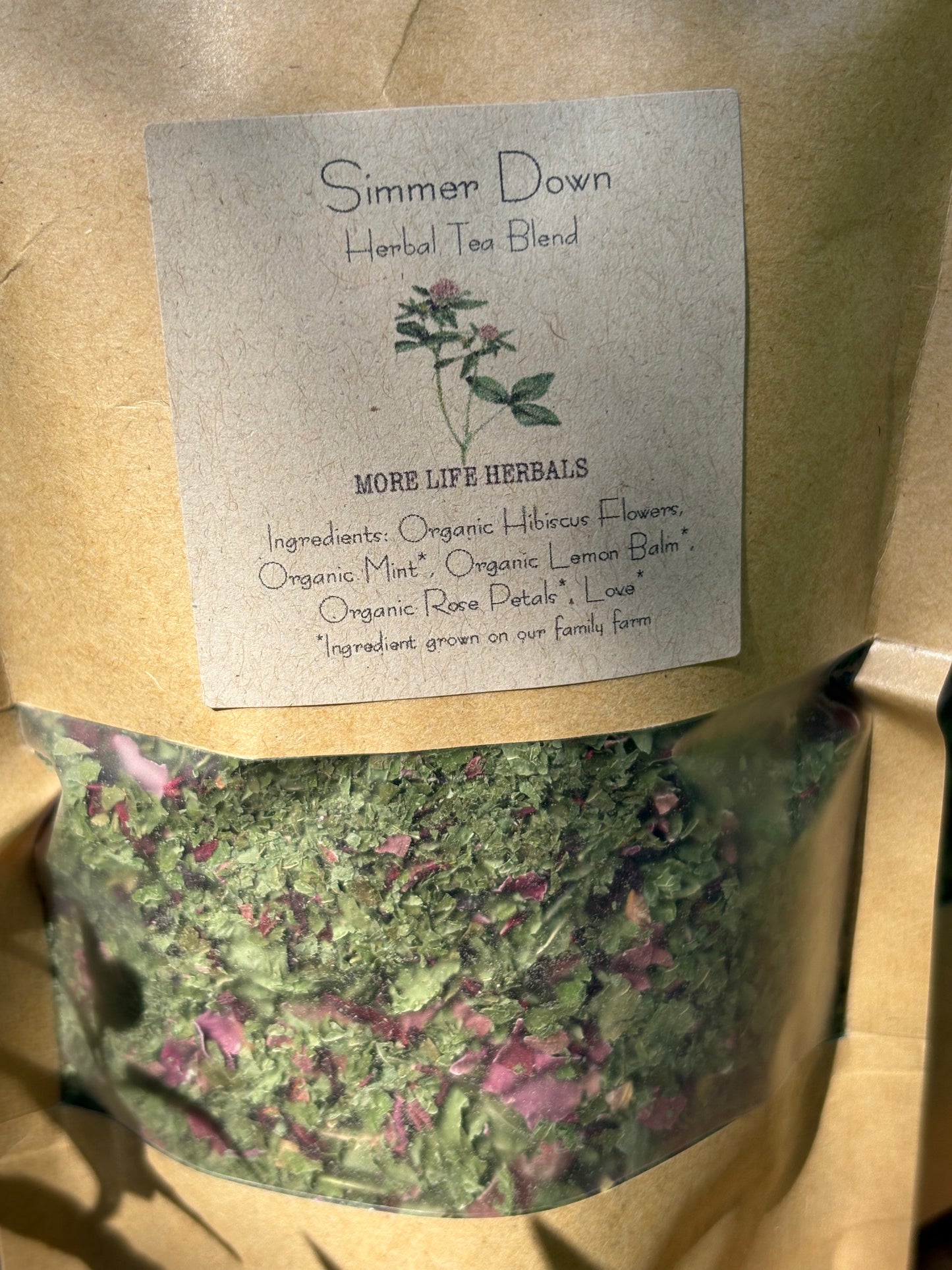 Herbal tea blend package with a label on a brown background