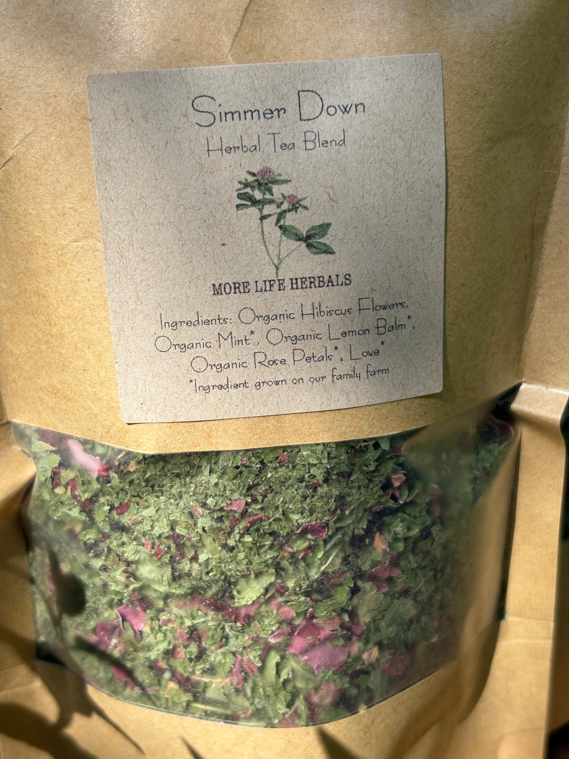 Herbal tea blend package with a label on a brown background